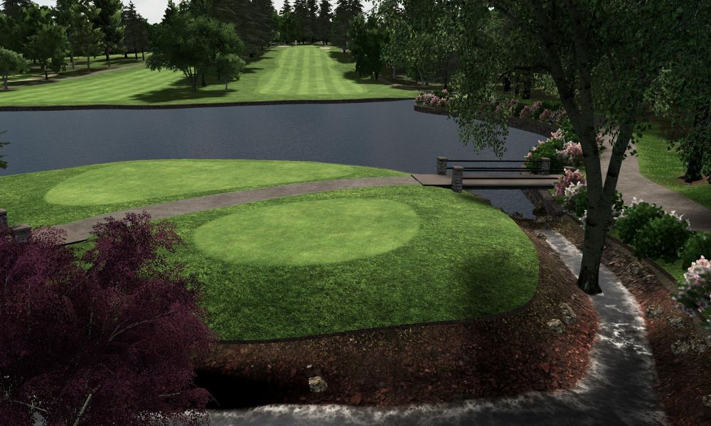Golf course with tee box, fairway, pond, and trees