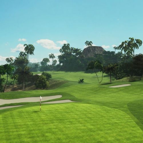 Devils Island course with green grass, sand bunkers, and palm trees under a clear blue sky.