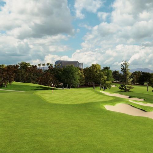 Hillcrest CC with green grass, trees, and a building in the distance under a cloudy sky.
